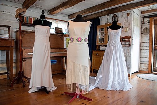 ALEX LUPUL / WINNIPEG FREE PRESS  

Dresses designed by Edna Nabess of the Mathias Colomb Cree Nation are photographed in the log house at The Nellie McClung Heritage Site in Manitou on August, 23, 2021. The I DO Exhibit celebrates the 125th wedding anniversary of Wes and Nellie McClung. Nellie McClung was a pioneer teacher, author, suffragist, social reformer, lecturer and legislator