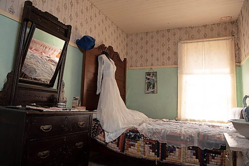 ALEX LUPUL / WINNIPEG FREE PRESS  

A gown is photographed in the bedroom Nellie McClung stayed in when she was a teacher at The Nellie McClung Heritage Site in Manitou on August, 23, 2021. The I DO Exhibit celebrates the 125th wedding anniversary of Wes and Nellie McClung. Nellie McClung was a pioneer teacher, author, suffragist, social reformer, lecturer and legislator