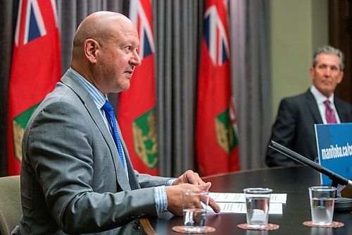 MIKAELA MACKENZIE / WINNIPEG FREE PRESS

Chief provincial public health officer Dr. Brent Roussin (front) and premier Brian Pallister speak at a press conference at the Manitoba Legislative Building in Winnipeg on Tuesday, Aug. 24, 2021. For --- story.
Winnipeg Free Press 2021.