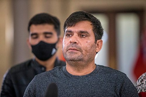 MIKAELA MACKENZIE / WINNIPEG FREE PRESS

Mushtaqu Rahman speaks about the Afghanistan refugee crisis with his family at the Manitoba Legislative Building in Winnipeg on Tuesday, Aug. 24, 2021. For --- story.
Winnipeg Free Press 2021.