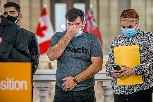 MIKAELA MACKENZIE / WINNIPEG FREE PRESS

Mushtaqu Rahman wipes his eyes after speaking about the Afghanistan refugee crisis with his family at the Manitoba Legislative Building in Winnipeg on Tuesday, Aug. 24, 2021. For --- story.
Winnipeg Free Press 2021.