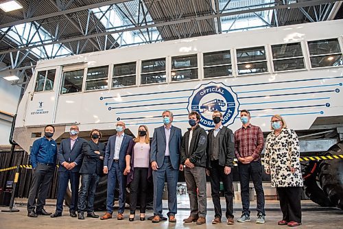ALEX LUPUL / WINNIPEG FREE PRESS  

Speakers and other guests stand in front of Frontiers North Adventures' newly unveiled fully electric tundra buggy at Red River College's Vehicle Technology & Energy Centre on August 24, 2021.