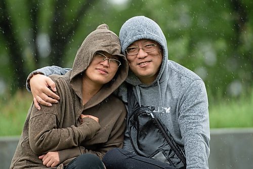 MIKE SUDOMA / Winnipeg Free Press
(Left to right) Wendy Wen and Sean Li share a moment while watching a performance at The Leaf Outdoor Gardens Friday afternoon
August 27, 2021