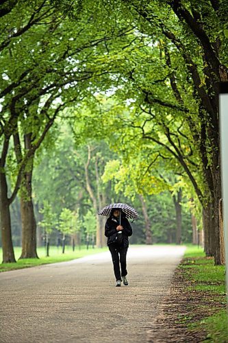 MIKE SUDOMA / Winnipeg Free Press
Brenda VanDekerhovr takes a rainy walk through The Leaf Outdoor Gardens in Assiniboine Park 
August 27, 2021