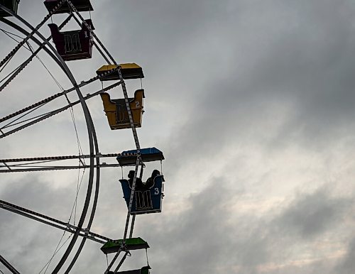 MIKE SUDOMA / Winnipeg Free Press
A lone group share a car on the Ferris wheel at the Red River Exhibitions Autumn Fair, Friday night
August 27, 2021