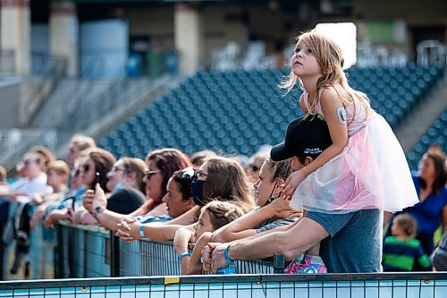 Daniel Crump / Winnipeg Free Press. A young girl sits on her dads shoulders as Chantal Kreviazuk performs at the Unite Manitoba 150 celebrations at Shaw Park in downtown Winnipeg. August 28, 2021.