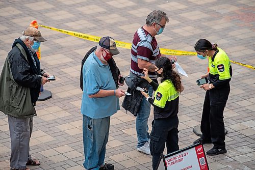 ALEX LUPUL / WINNIPEG FREE PRESS  

Concert goers line up to have their proof of vaccination scanned in order to enter Shaw Park for the Unite 150 concert on August, 28, 2021.