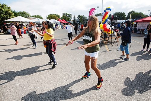 JOHN WOODS / WINNIPEG FREE PRESS
Verlie Maco, centre, takes part in a Zumba class at the Manitoba Street Festival at the Philippine Canadian Centre of Manitoba in Winnipeg Sunday, August 29, 2021.

Reporter: ?