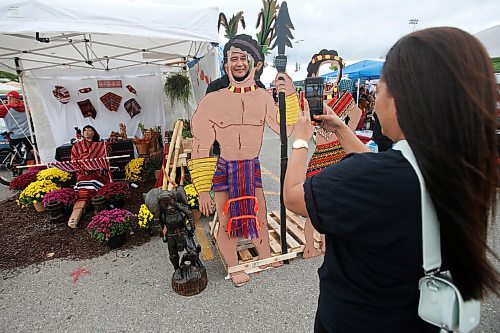 JOHN WOODS / WINNIPEG FREE PRESS
Kelly takes a photo of Issi Bartolomb at BIBAK booth at the Manitoba Street Festival at the Philippine Canadian Centre of Manitoba in Winnipeg Sunday, August 29, 2021. 

Reporter: ?