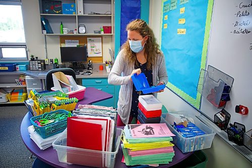 MIKE DEAL / WINNIPEG FREE PRESS
Grade 5 teacher, Kimberley Peters, packs some kits of school supplies for her students as she prepares for a new school year at Ecole Julie-Riel.
See Maggie Macintosh story
210901 - Wednesday, September 01, 2021.