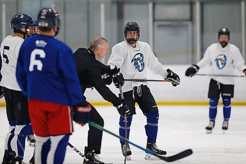 JOHN WOODS / WINNIPEG FREE PRESS
Omen Harmacy (2) listens to James Patrick, head coach of the Winnipeg Ice, at practise in Winnipeg Wednesday, September 1, 2021. 

Reporter: Sawatzky