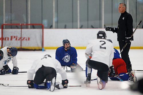 JOHN WOODS / WINNIPEG FREE PRESS
Aiden Oiring (7) listens to James Patrick, head coach of the Winnipeg Ice, at practise in Winnipeg Wednesday, September 1, 2021. 

Reporter: Sawatzky