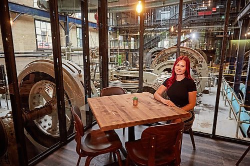 MIKE DEAL / WINNIPEG FREE PRESS
General Manager Kaitlin Nikkel at one of the tables that look out onto the preserved area of the pumphouse.
James Avenue Pumphouse (2-109 James Ave)
After months of renovations, a new restaurant is opening this month in the historic James Avenue Pumphouse building in the east Exchange District.
See Eva Wasney story
210902 - Thursday, September 02, 2021.
