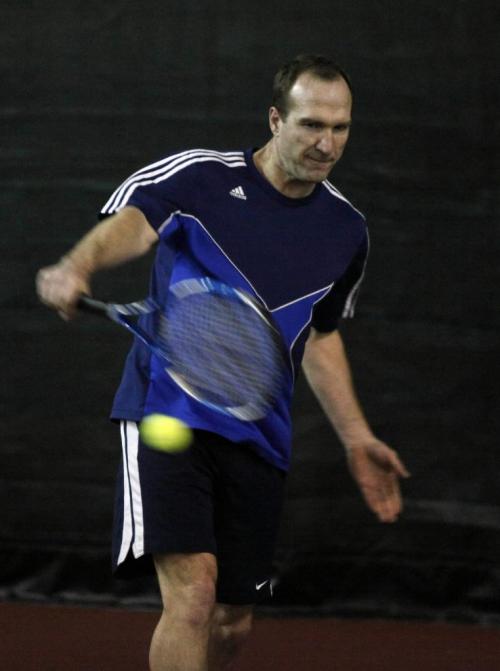 BORIS.MINKEVICH@FREEPRESS.MB.CA  100505 BORIS MINKEVICH / WINNIPEG FREE PRESS Tennis player Ray Daumler hits the ball at the Taylor Tennis Club.