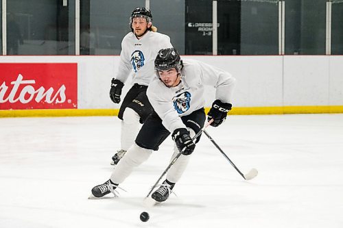 Daniel Crump / Winnipeg Free Press. Matt Savoie (12), a forward for the Winnipeg Ice, skates during training camp at the Rink training facility, Friday evening. September 3, 2021.