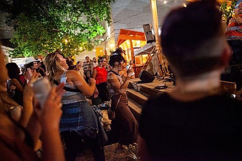 Daniel Crump / Winnipeg Free Press. People dance to the sounds of the Dirty Catfish Brass band at Blue Note Park on Main Street. September 3, 2021.