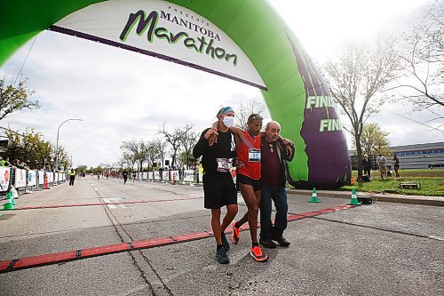 JOHN WOODS / WINNIPEG FREE PRESS
A man is helped across the finish line at the Manitoba Marathon at the University of Manitoba in Winnipeg Sunday, September 5, 2021. 
Reporter: ?