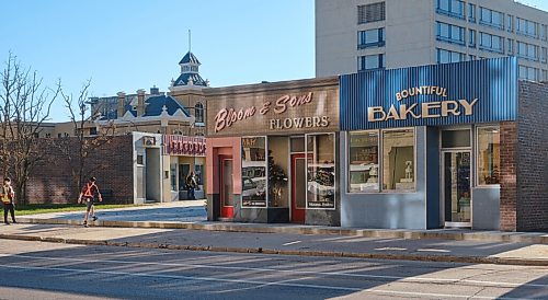 MIKE DEAL / WINNIPEG FREE PRESS
Crews hustle about on the set of the movie, Dark Harvest, which has sprung up in the empty lot where the Market Lands housing development will be across from City Hall on Princess Street. 
210907 - Tuesday, September 07, 2021.