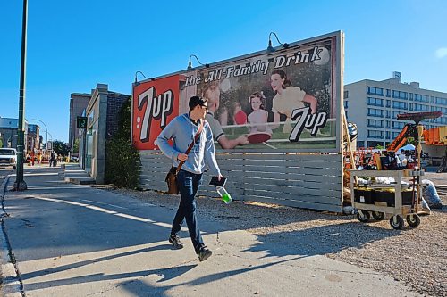 MIKE DEAL / WINNIPEG FREE PRESS
Crews hustle about on the set of the movie, Dark Harvest, which has sprung up in the empty lot where the Market Lands housing development will be across from City Hall on Princess Street. 
210907 - Tuesday, September 07, 2021.