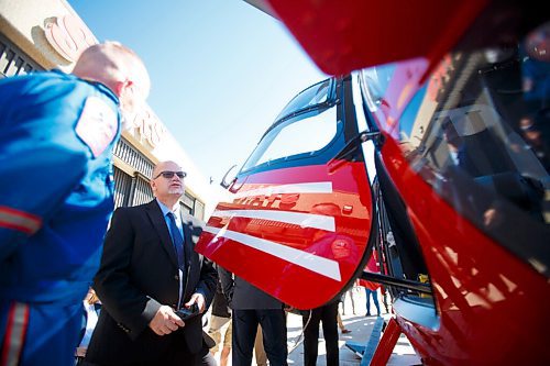 MIKE DEAL / WINNIPEG FREE PRESS
Premier Kelvin Goertzen checks out the new STARS Airbus H145 helicopter at its base at the Winnipeg Airport Monday morning. 
STARS air ambulance introduced its first new Airbus H145 helicopter to Manitoba at its hangar in Winnipeg today.
The new Shock Trauma Air Rescue Service air ambulance is one of 10 that will replace the western Canada fleet.
210907 - Tuesday, September 07, 2021.