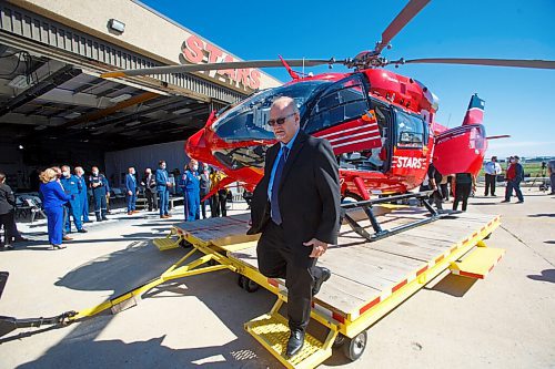 MIKE DEAL / WINNIPEG FREE PRESS
Premier Kelvin Goertzen checks out the new STARS Airbus H145 helicopter at its base at the Winnipeg Airport Monday morning. 
STARS air ambulance introduced its first new Airbus H145 helicopter to Manitoba at its hangar in Winnipeg today.
The new Shock Trauma Air Rescue Service air ambulance is one of 10 that will replace the western Canada fleet.
210907 - Tuesday, September 07, 2021.