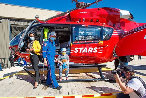 MIKE DEAL / WINNIPEG FREE PRESS
Kaleb Levi Labelle, 6, a VIP who was transported after an accident by STARS in 2016, checks out the new helicopter.
STARS air ambulance introduced its first new Airbus H145 helicopter to Manitoba at its hangar in Winnipeg today.
The new Shock Trauma Air Rescue Service air ambulance is one of 10 that will replace the western Canada fleet.
210907 - Tuesday, September 07, 2021.