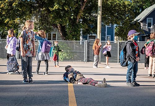 JESSICA LEE/WINNIPEG FREE PRESS

A student takes a rest while waiting for the school bell to ring at Glenelm Community School on September 8, 2021.

Reporter: Maggie