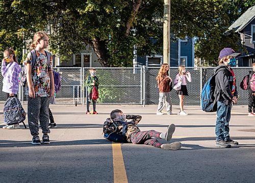 JESSICA LEE/WINNIPEG FREE PRESS

A student takes a rest while waiting for the school bell to ring at Glenelm Community School on September 8, 2021.

Reporter: Maggie