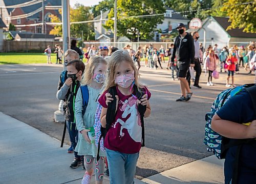 JESSICA LEE/WINNIPEG FREE PRESS

Olivia Walker, who is going into grade 2, walks into Glenelm Community School for the first day of school on September 8, 2021.

Reporter: Maggie