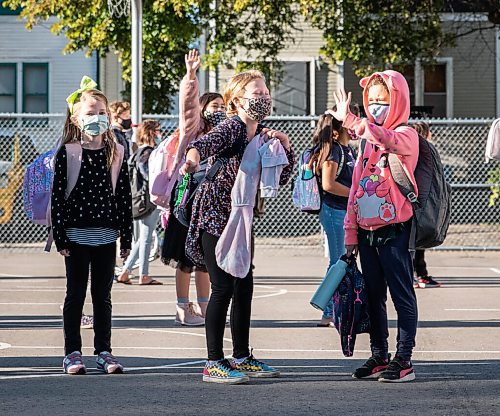 JESSICA LEE/WINNIPEG FREE PRESS

Students wave to their classmates on the first day of school at Glenelm Community School on September 8, 2021. Now that there are COVID restrictions, students cannot hug each other.

Reporter: Maggie