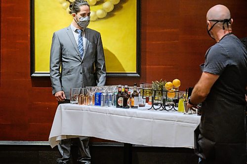 MIKE DEAL / WINNIPEG FREE PRESS
CAPS Manitoba sommelier contestants, Felix Faundez Rubio (left) and Danny King (right) check out the table of available drinks prior to the start of the provincial sommelier competition at Hys (1 Lombard Place) in the Richardson Building Wednesday afternoon.
See Ben Sigurdson story
210908 - Wednesday, September 08, 2021.