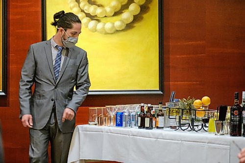 MIKE DEAL / WINNIPEG FREE PRESS
CAPS Manitoba sommelier contestant, Felix Faundez Rubio checks out the table of available drinks prior to the start of the provincial sommelier competition at Hys (1 Lombard Place) in the Richardson Building Wednesday afternoon.
See Ben Sigurdson story
210908 - Wednesday, September 08, 2021.