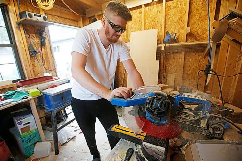 JOHN WOODS / WINNIPEG FREE PRESS
Matt Proutt cuts wood at his home workshop in Selkirk Wednesday, September 8, 2021. Matt and Kaelyn Proutt have started M+K Wood Co., a business that started as a cabinet supplier but now turns out custom, wooden kennels for dogs.

Reporter: ?