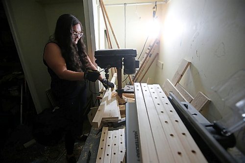 JOHN WOODS / WINNIPEG FREE PRESS
Kaelyn Proutt drills holes in wood at her basement workshop in Selkirk Wednesday, September 8, 2021. Matt and Kaelyn Proutt have started M+K Wood Co., a business that started as a cabinet supplier but now turns out custom, wooden kennels for dogs.

Reporter: ?