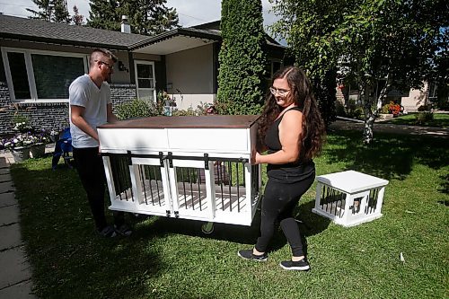 JOHN WOODS / WINNIPEG FREE PRESS
Kaelyn and Matt Proutt set up some finished kennels at their home in Selkirk Wednesday, September 8, 2021. Matt and Kaelyn Proutt have started M+K Wood Co., a business that started as a cabinet supplier but now turns out custom, wooden kennels for dogs.

Reporter: ?