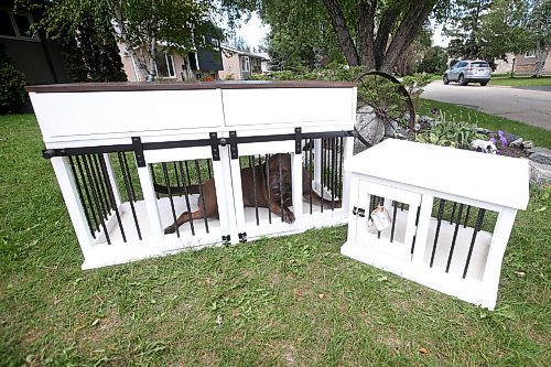 JOHN WOODS / WINNIPEG FREE PRESS
Callie shows how roomy her kennel is outside her home in Selkirk Wednesday, September 8, 2021. Matt and Kaelyn Proutt have started M+K Wood Co., a business that started as a cabinet supplier but now turns out custom, wooden kennels for dogs.

Reporter: ?