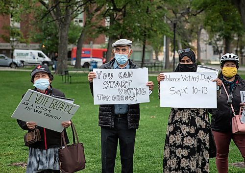 JESSICA LEE/WINNIPEG FREE PRESS

Habibullah Ibrahim (centre) holds a sign at an event hosted by newcomer groups in Central Park on September 9, 2021. The event was hosted to encourage citizens with immigrant and refugee backgrounds to vote.

Reporter: Julia-Simone