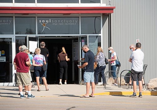 MIKE SUDOMA / Winnipeg Free Press
Voters wait a long line up outside of the polling station located at 2050 Chevrier Blvd Friday afternoon
September 10, 2021
