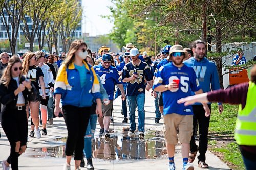 Daniel Crump / Winnipeg Free Press. Football fans make their way to IG Field prior to game time Saturday afternoon for the Banjo Bowl. September 11, 2021.