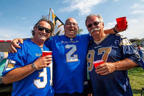 Daniel Crump / Winnipeg Free Press. (L to R) Wade Ahronson, Bain Giesbrecht, and Dennis Giesbrecht pregame during the tailgate at IG Field prior to the Banjo Bowl, Saturday afternoon. September 11, 2021.