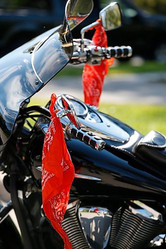 JOHN WOODS / WINNIPEG FREE PRESS
Orange bandanas hang from a motorcycle at an Every Child Matters powwow at Vimy Ridge Park in Winnipeg Sunday, September 12, 2021. 

Reporter: May