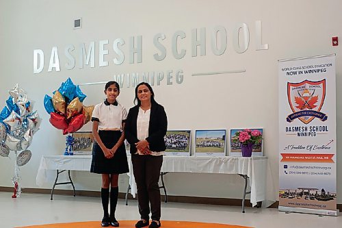 Canstar Community News Principal Amandeep Sran (at right) poses with daughter Mannatvir in one of the common rooms at the new Dasmesh School. After nine years of moving from space to space, the English-Sikh school has built a permanent home in West St. Paul