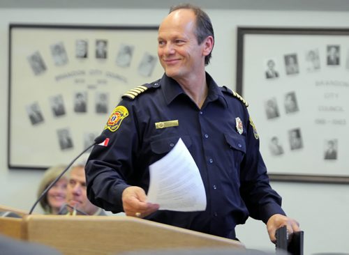 Brandon Sun Brandon Fire Chief Brent Dane prepares to speak to city council, Monday evening. Dane was bringing news of a design award the city's new fire hall received as well as a locally-produced book on the department's old hall on Princess Avenue. CHECK ALLISON COPY FOR FULL CUTLINE INFO (Colin Corneau/Brandon Sun)