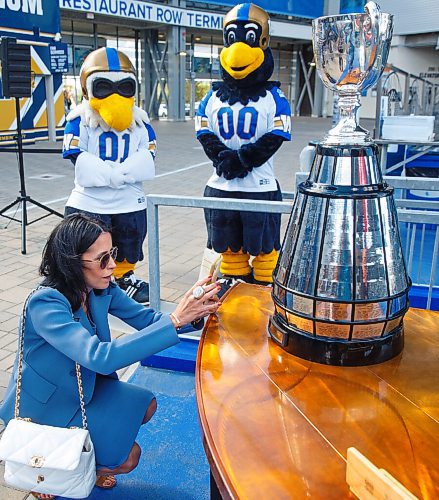 MIKE DEAL / WINNIPEG FREE PRESS
Dayna Spiring, chair, board of directors, Winnipeg Football Club takes a photo of the 2019 championship plaque on the Grey Cup with her name on it before a ceremony at IG Field Tuesday afternoon.
Premier Kelvin Goertzen, Wade Miller, president and CEO, Winnipeg Football Club and Dayna Spiring, chair, board of directors, Winnipeg Football Club along with other dignitaries were on hand at IG Field Tuesday afternoon, for the signing-in of the 2019 Grey Cup Champions into the Order of the Buffalo Hunt.
210914 - Tuesday, September 14, 2021.