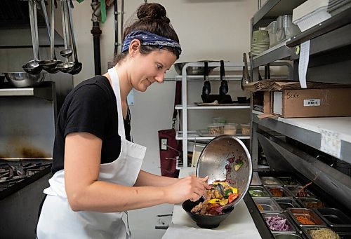 JESSICA LEE/WINNIPEG FREE PRESS

Christy Barkman makes a Tuscan Panzanella bowl at Cocoabeans, a gluten-free bakery and restaurant, on September 15, 2021.

Reporter: Declan