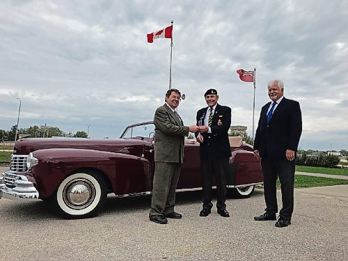 Canstar Community News Bob Beach (centre) presented the keys to his 1946 Lincoln Continental convertible to members of the Masonic Foundation of Manitoba's executive on Sept. 15. The gift, valued at $135,000, which is the largest in kind gift the Masonic Foundation of Manitoba has ever received, will go towards helping fund a number of the group's initiatives. (SHELDON BIRNIE/CANSTAR/THE HERALD)