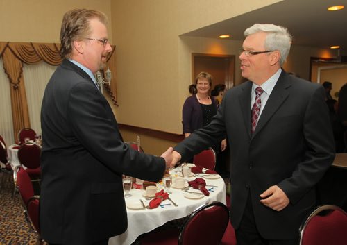 Brandon Sun Brandon Sun Managing Editor James O'Connor shakes hands with Premier Greg Selinger prior to yesterday's State of the Province address to the Brandon Chamber of Commerce at the Imperial Ballroom. (Bruce Bumstead/Brandon Sun)