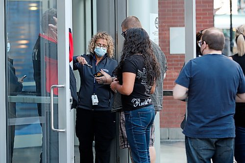 JOHN WOODS / WINNIPEG FREE PRESS
Fans line up to enter the Electric Circus concert at a downtown arena in Winnipeg Tuesday, September 21, 2021. 

Reporter: ?