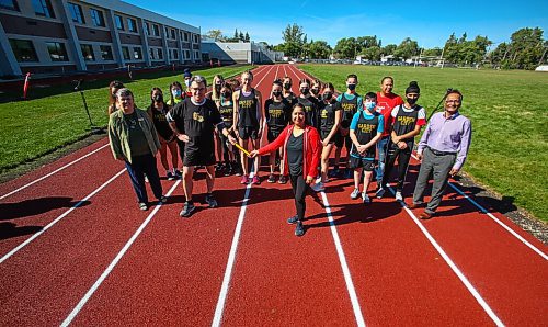 MIKE DEAL / WINNIPEG FREE PRESS
Councillors Brian Mayes and Devi Sharma and members of the Garden City Collegiate cross country running team at the opening of a state-of-the-art rubberized track at Garden City Collegiate Wednesday afternoon.
210922 - Wednesday, September 22, 2021.