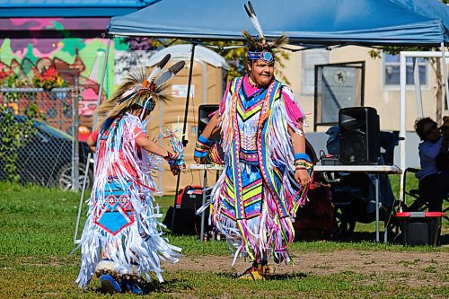 MIKE DEAL / WINNIPEG FREE PRESS
Mak Kennedy, 8, and his brother, Mally, 14, dance during the mini pop-up 2S Powwow in Broadway Neighbourhood Park Wednesday afternoon.
210922 - Wednesday, September 22, 2021.